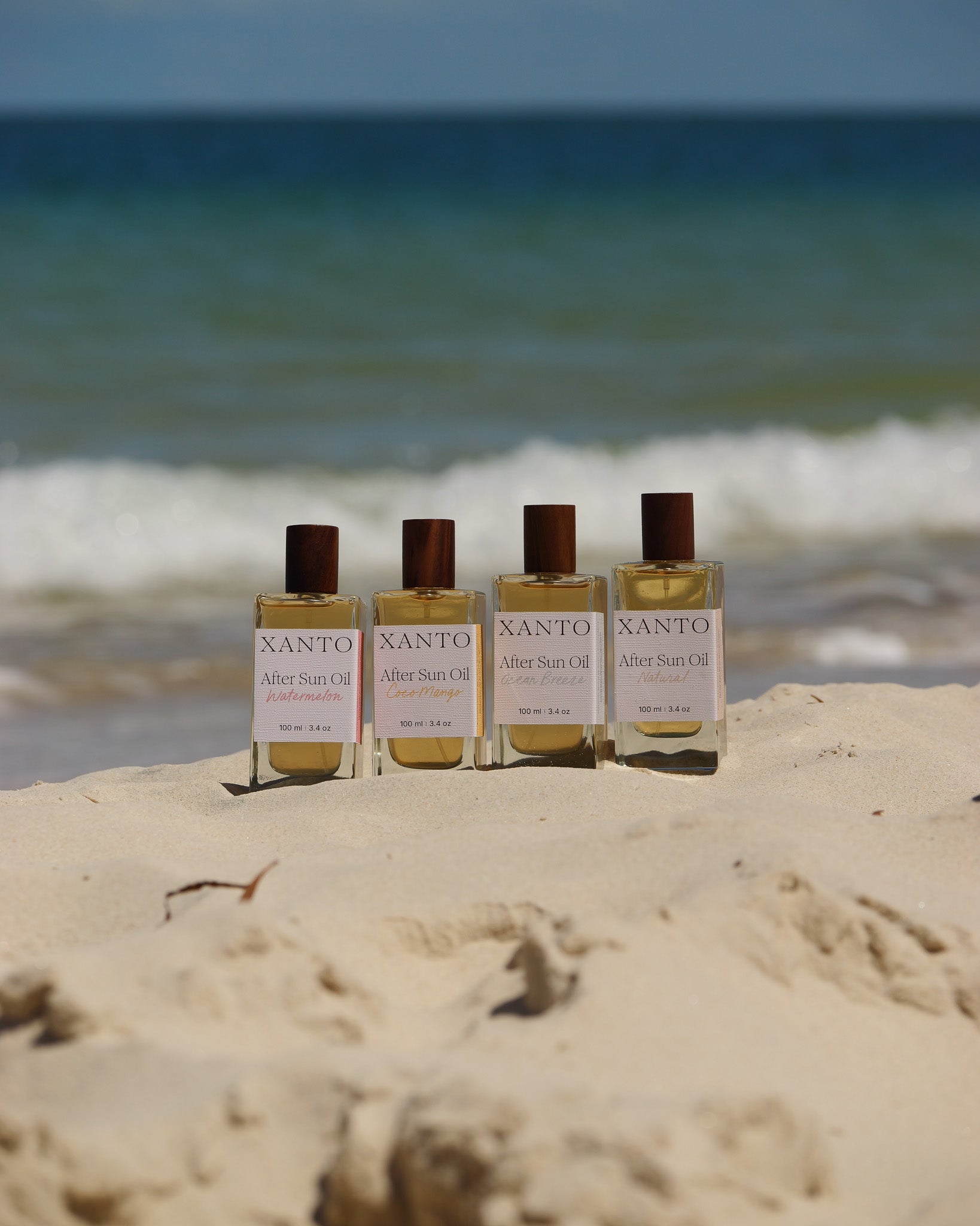 Xanto After Sun Oil glowing on a sun-kissed beach for luxurious skin hydration and rejuvenation