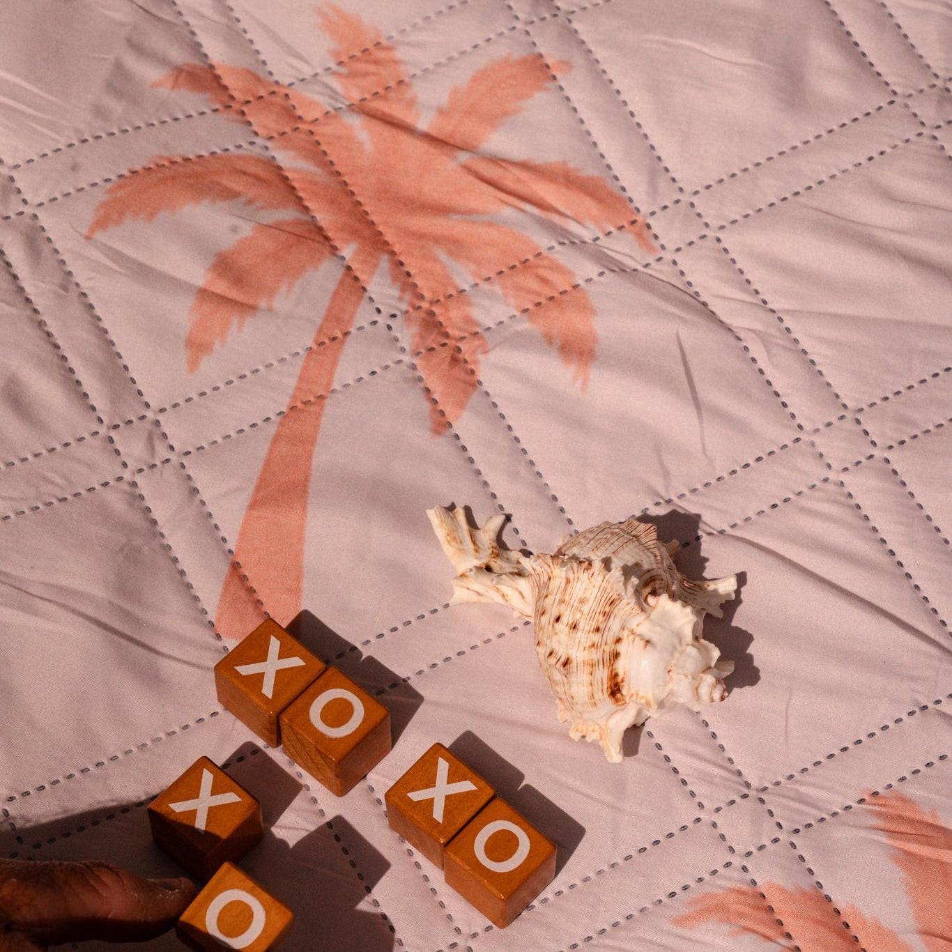 Beach picnic setup on a colorful beach blanket perfect for outdoor relaxation and enjoyment