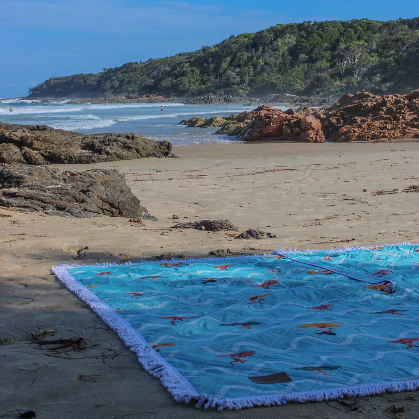 Beach picnic fun on a colorful beach blanket, perfect picnic blanket for sandy snack attacks!